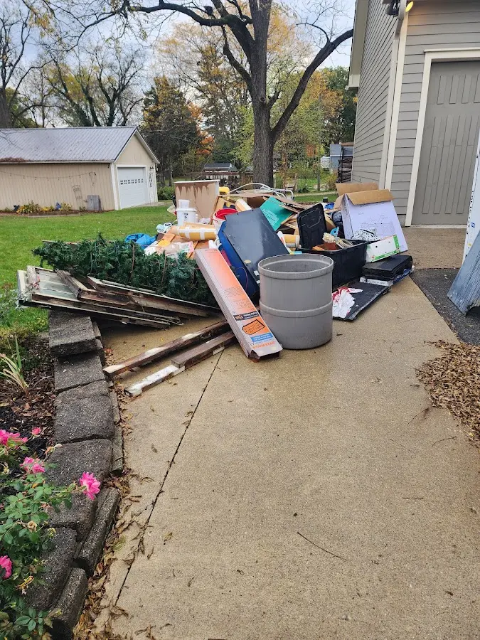 Dumpster being loaded with debris for Residential Dumpster Rental in Washington